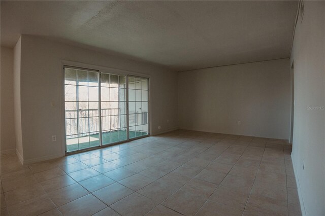 empty room with light tile patterned floors