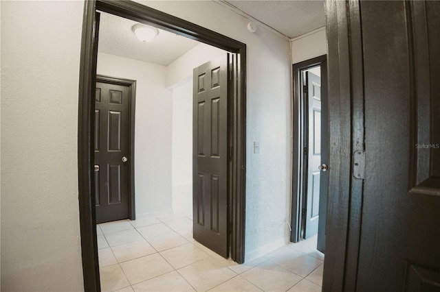 hall with light tile patterned flooring