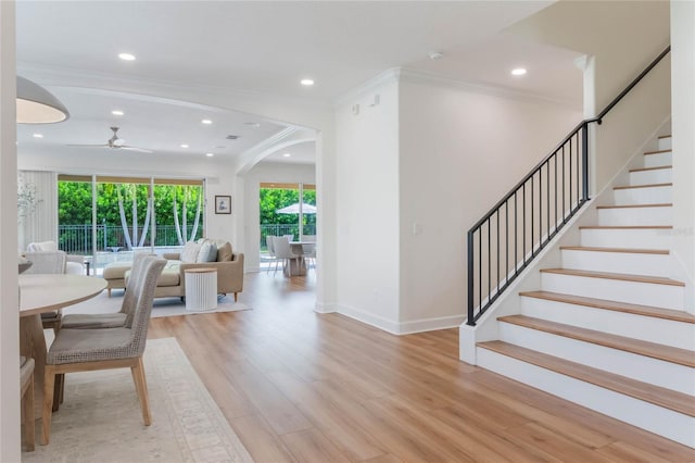 11826 Fiore Dr, Orlando, FL 32827 - unfurnished dining area featuring stairs, ornamental molding, light wood-style floors, and a ceiling fan