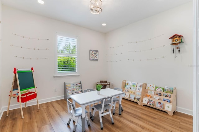11826 Fiore Dr, Orlando, FL 32827 - game room with baseboards, light wood finished floors, and recessed lighting