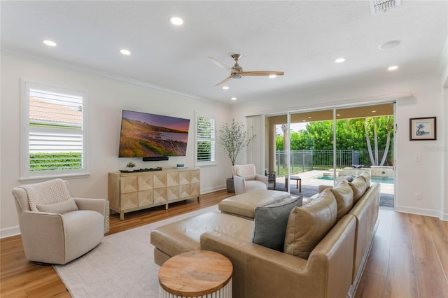 11826 Fiore Dr, Orlando, FL 32827 - living area featuring recessed lighting, ornamental molding, visible vents, a ceiling fan, and wood finished floors