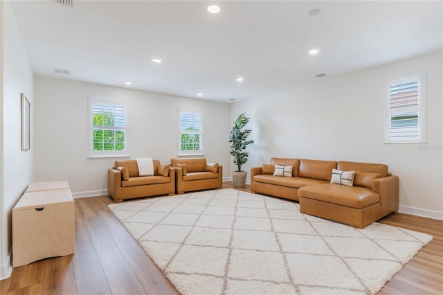 11826 Fiore Dr, Orlando, FL 32827 - living room featuring visible vents, wood finished floors, and recessed lighting