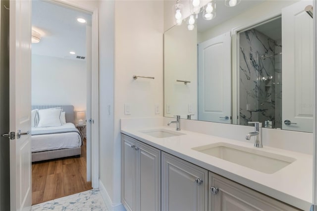 11826 Fiore Dr, Orlando, FL 32827 - bathroom with ensuite bathroom, double vanity, visible vents, and a sink