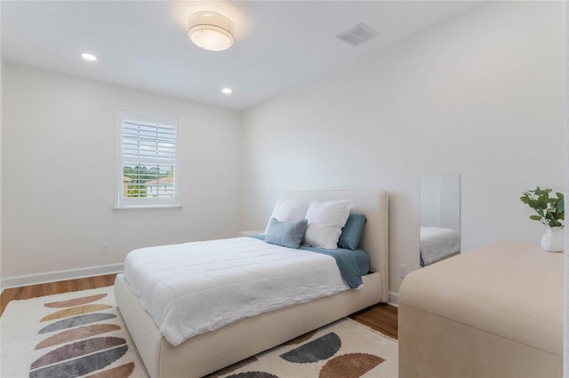 11826 Fiore Dr, Orlando, FL 32827 - bedroom featuring baseboards, visible vents, recessed lighting, and wood finished floors