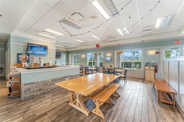 11826 Fiore Dr, Orlando, FL 32827 - dining area featuring wood finished floors and a paneled ceiling