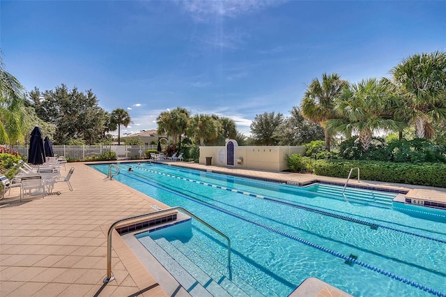 11826 Fiore Dr, Orlando, FL 32827 - community pool featuring fence and a patio