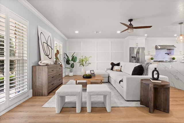201 Cedarwood Dr, Maitland, FL 32751 - living area with a ceiling fan, light wood-style floors, and crown molding