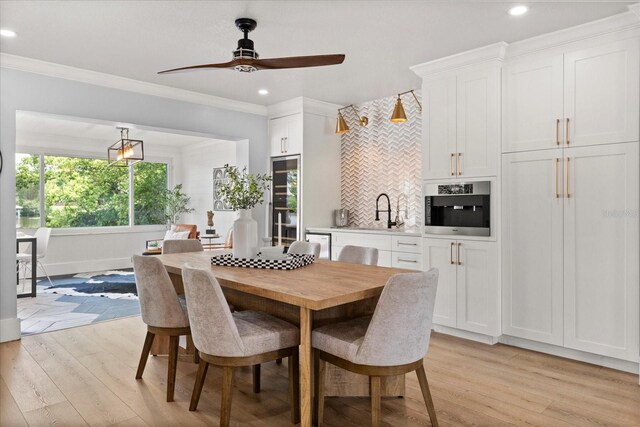 201 Cedarwood Dr, Maitland, FL 32751 - dining area featuring a ceiling fan, crown molding, light wood-style flooring, and recessed lighting