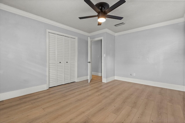 201 Cedarwood Dr, Maitland, FL 32751 - unfurnished bedroom featuring ornamental molding, baseboards, light wood finished floors, and visible vents
