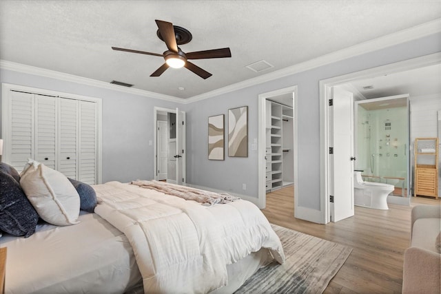 201 Cedarwood Dr, Maitland, FL 32751 - bedroom featuring visible vents, a closet, light wood-style floors, and ornamental molding
