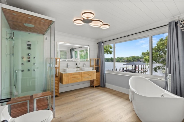 201 Cedarwood Dr, Maitland, FL 32751 - full bathroom featuring a soaking tub, a shower stall, double vanity, wood finished floors, and wooden ceiling