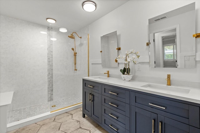201 Cedarwood Dr, Maitland, FL 32751 - bathroom featuring double vanity, visible vents, a walk in shower, and a sink