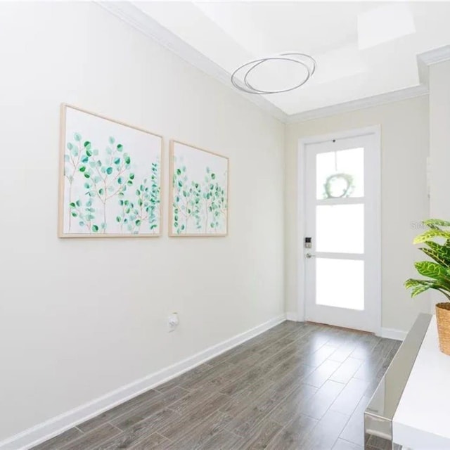 14711 Winter Stay Dr, Winter Garden, FL 34787 - entryway with wood finished floors, baseboards, and ornamental molding