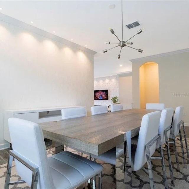 14711 Winter Stay Dr, Winter Garden, FL 34787 - dining space featuring arched walkways, a chandelier, ornamental molding, recessed lighting, and baseboards