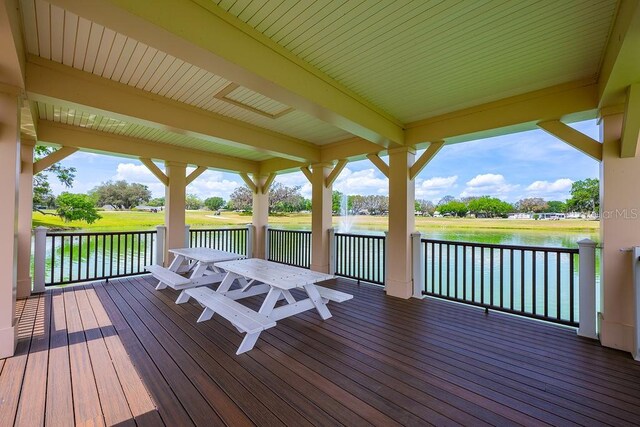 wooden deck with a water view