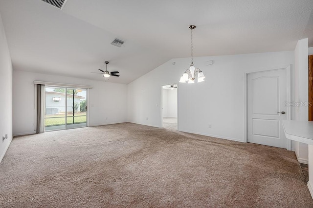 unfurnished room with vaulted ceiling, carpet flooring, ceiling fan with notable chandelier, baseboards, and visible vents