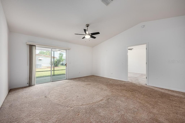 spare room featuring vaulted ceiling, baseboards, visible vents, ceiling fan, and carpet