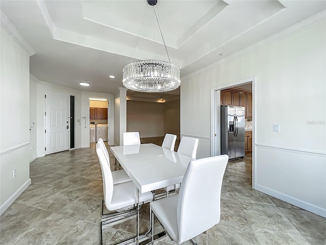 8743 S The Esplanade Unit 18, Orlando, FL 32836 - dining space featuring independent washer and dryer, a chandelier, a tray ceiling, and recessed lighting