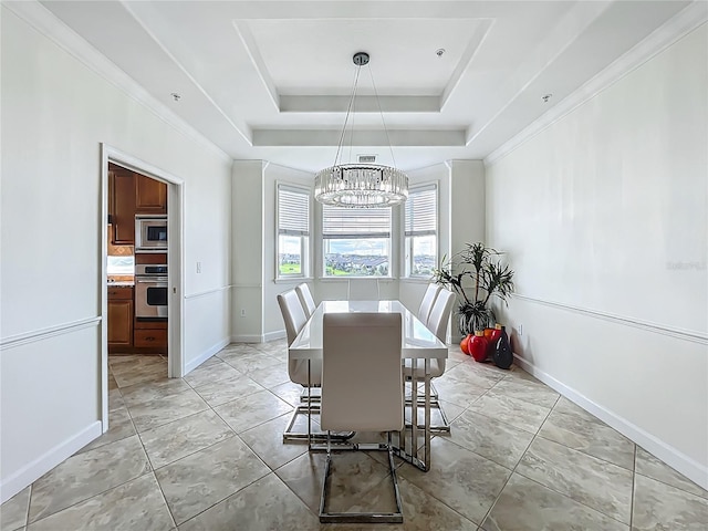 8743 S The Esplanade Unit 18, Orlando, FL 32836 - dining room with a chandelier and a raised ceiling