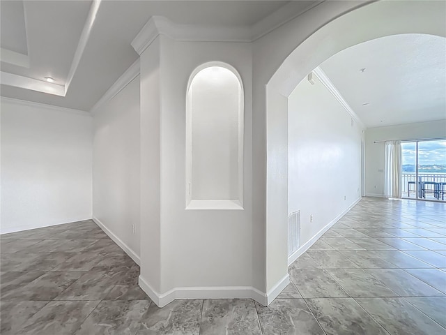 8743 S The Esplanade Unit 18, Orlando, FL 32836 - hall with arched walkways, ornamental molding, and lofted ceiling