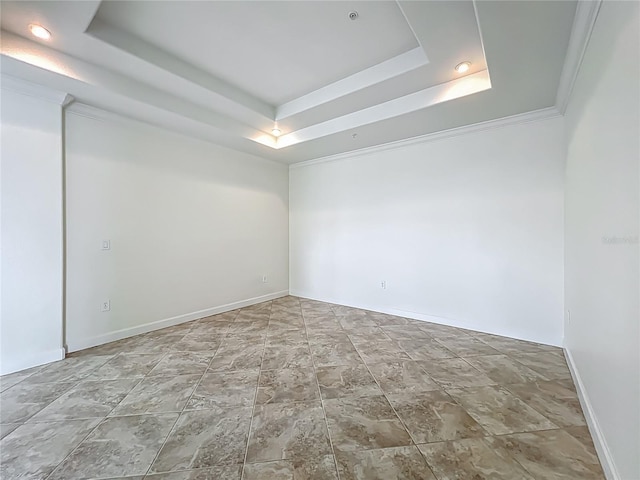 8743 S The Esplanade Unit 18, Orlando, FL 32836 - unfurnished room featuring a tray ceiling, stone finish floors, and recessed lighting