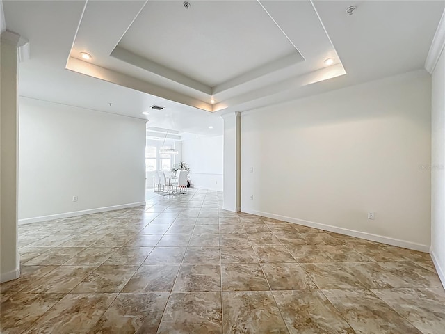 8743 S The Esplanade Unit 18, Orlando, FL 32836 - unfurnished room featuring a tray ceiling and a chandelier