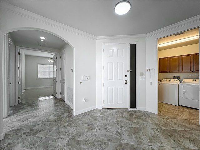 8743 S The Esplanade Unit 18, Orlando, FL 32836 - entryway with arched walkways, independent washer and dryer, crown molding, and ceiling fan