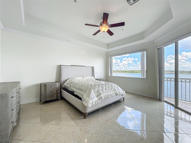 8743 S The Esplanade Unit 18, Orlando, FL 32836 - bedroom with a raised ceiling, access to exterior, light tile patterned flooring, a ceiling fan, and a water view