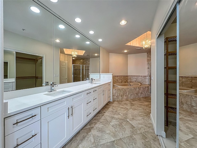 8743 S The Esplanade Unit 18, Orlando, FL 32836 - full bathroom with a spacious closet, a bath, double vanity, a shower stall, and recessed lighting