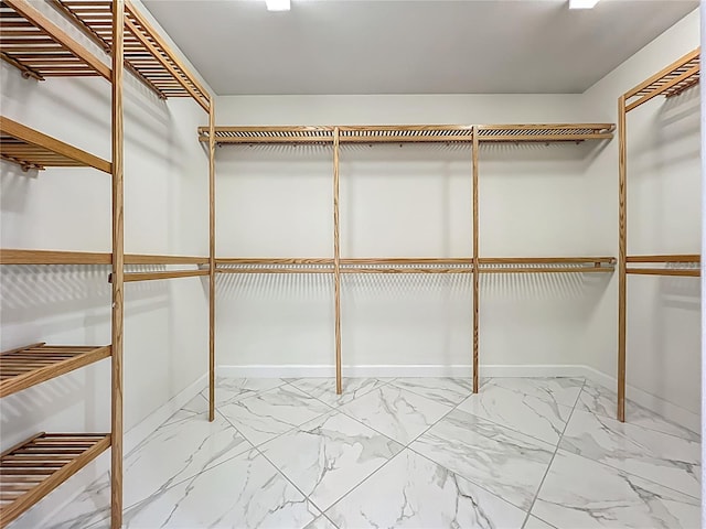 8743 S The Esplanade Unit 18, Orlando, FL 32836 - spacious closet featuring marble finish flooring