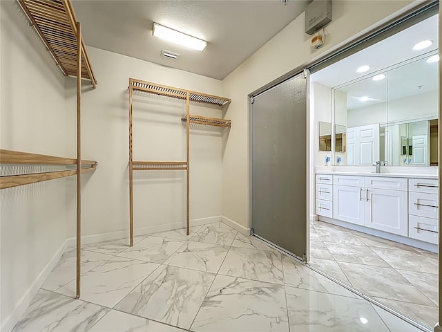 8743 S The Esplanade Unit 18, Orlando, FL 32836 - spacious closet with light marble finish floors