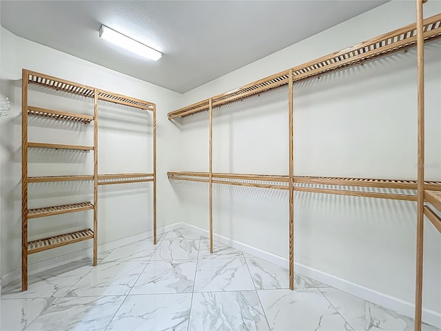 8743 S The Esplanade Unit 18, Orlando, FL 32836 - spacious closet with marble finish flooring