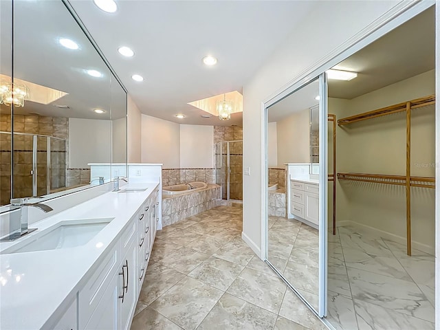 8743 S The Esplanade Unit 18, Orlando, FL 32836 - full bath featuring double vanity, a shower stall, a walk in closet, a garden tub, and recessed lighting