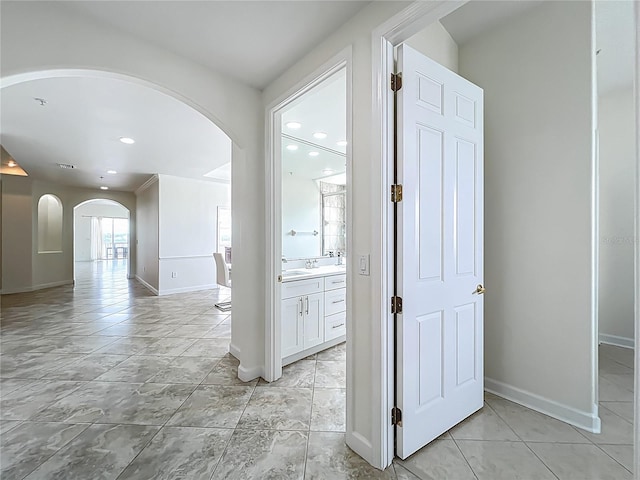 8743 S The Esplanade Unit 18, Orlando, FL 32836 - hall with arched walkways and recessed lighting