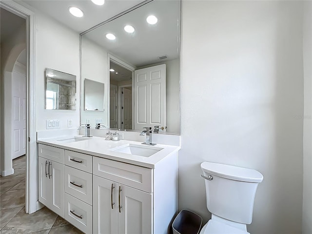 8743 S The Esplanade Unit 18, Orlando, FL 32836 - bathroom with double vanity, tile patterned flooring, and recessed lighting