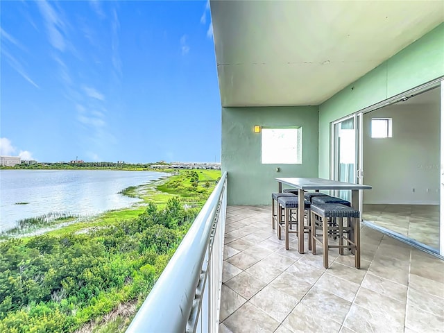 8743 S The Esplanade Unit 18, Orlando, FL 32836 - balcony with a water view and outdoor dining area