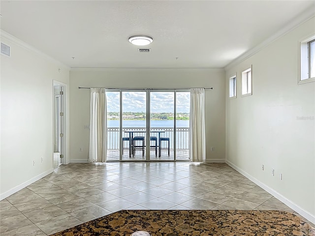 8743 S The Esplanade Unit 18, Orlando, FL 32836 - spare room featuring crown molding and a water view