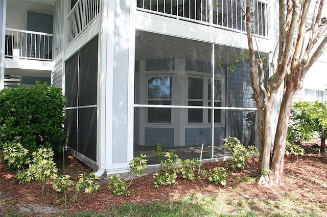 exterior space featuring a sunroom