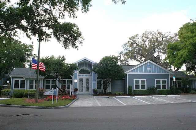 view of building exterior with uncovered parking