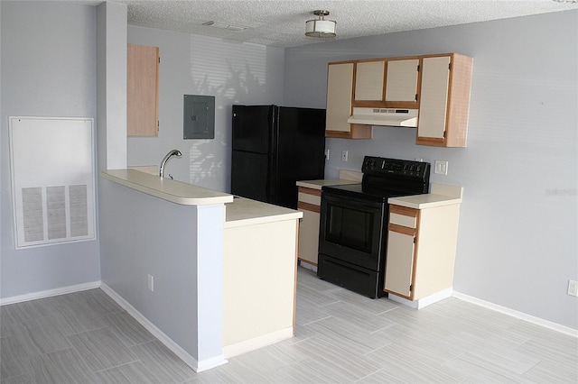 kitchen featuring light countertops, visible vents, electric panel, under cabinet range hood, and black appliances