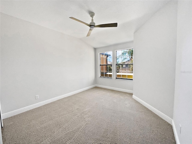 empty room with light carpet, baseboards, and ceiling fan