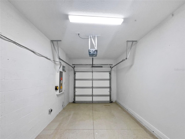 garage featuring electric panel, a garage door opener, and baseboards
