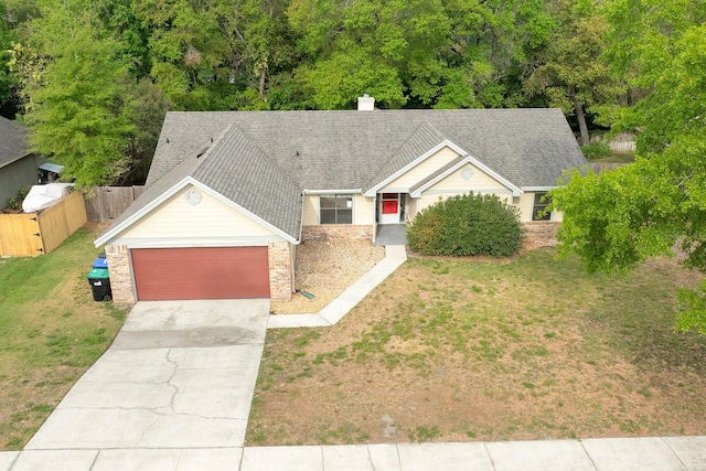 2132 Majestic Woods Blvd, Apopka, FL 32712 - ranch-style home featuring fence, a garage, brick siding, a front lawn, and driveway