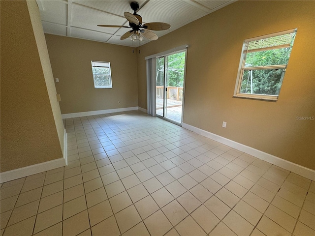 2132 Majestic Woods Blvd, Apopka, FL 32712 - empty room with a ceiling fan, light tile patterned floors, and baseboards