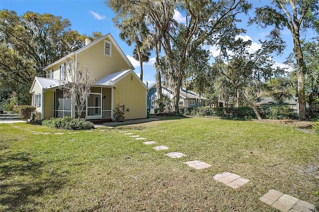 view of yard with a sunroom