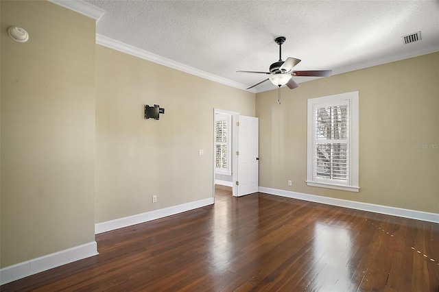 spare room with hardwood / wood-style floors, baseboards, ceiling fan, and visible vents