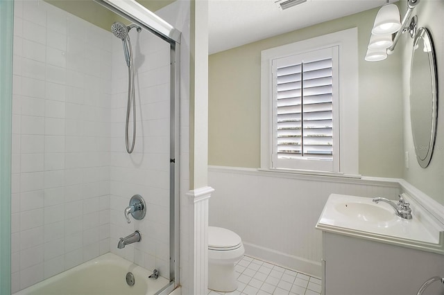 full bath featuring shower / bathing tub combination, vanity, tile patterned flooring, toilet, and baseboards