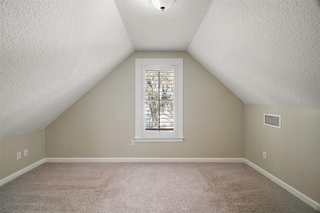 bonus room with carpet flooring, baseboards, and visible vents