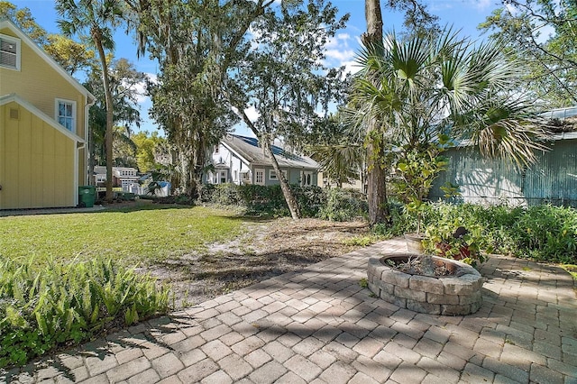 view of patio with an outdoor fire pit