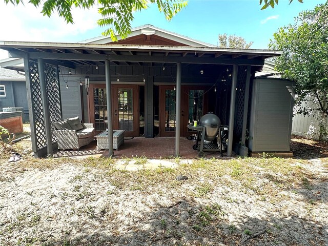 1098 Henry Balch Dr, Orlando, FL 32810 - rear view of house featuring a patio
